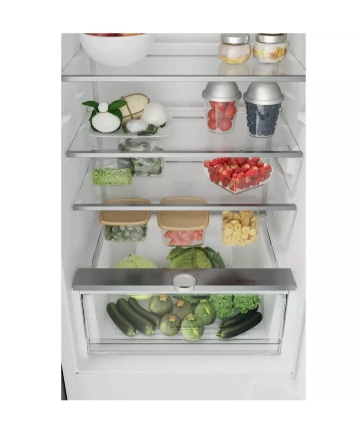 Hotpoint HTC18 T112 UK 70/30 No Frost Integrated Fridge Freezer with Sliding Hinge - E Rated fr com HomeWise Appliances. Stock photo showing contents in the fridge compartment