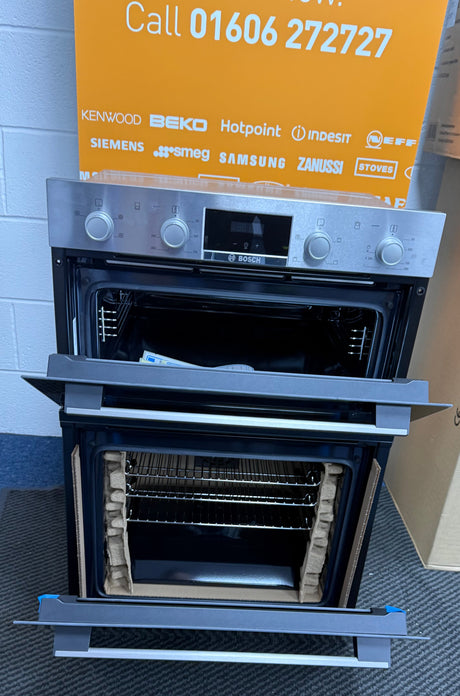 Bosch Series 2 MHA133BR0B (79) Built In Electric Double Oven in Stainless Steel from HomeWise Appliances. Showroom photo showing front of the oven with doors open.