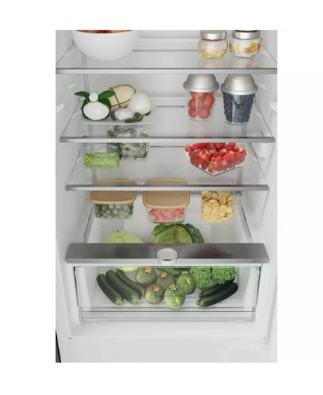 Hotpoint HTC18 T112 UK 70/30 No Frost Integrated Fridge Freezer with Sliding Hinge - E Rated fr com HomeWise Appliances. Stock photo showing contents in the fridge compartment 