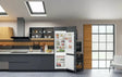 Hotpoint HTC18 T112 UK 70/30 No Frost Integrated Fridge Freezer with Sliding Hinge - E Rated from HomeWise Appliances. Stock photo with fridge freezer in a kitchen display