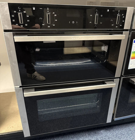 Neff N50 J1ACE2HN0b Double Built under Oven from HomeWise Appliances. Showroom photo showing front of the oven with doors closed.