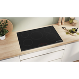 Bosch Series 6 PIV831HB1E 80cm 5-Zone Induction Hob in Black - Wi-Fi Enabled in a modern kitchen looking sleek and elegant.