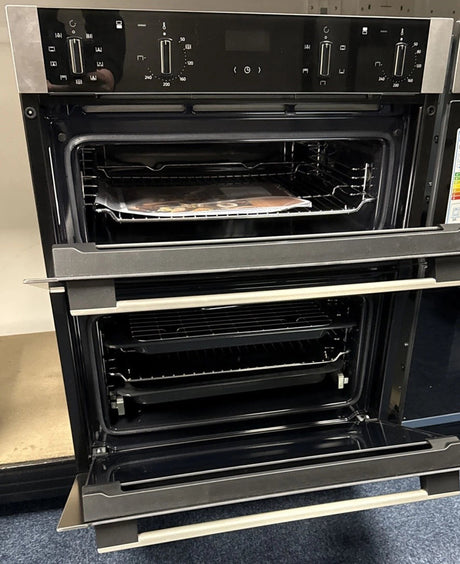 Neff N50 J1ACE2HN0b Double Built under Oven from HomeWise Appliances. Showroom photo showing front of oven with doors open. 