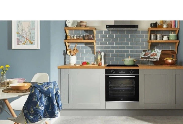 Beko Recycled Net® BBIS25300XC (61) Built-in Electric Single SimplySteam™ Oven with AeroPerfect™ - A Rated from HomeWise Appliances stock photo showing the oven as the centre piece of a family kitchen 