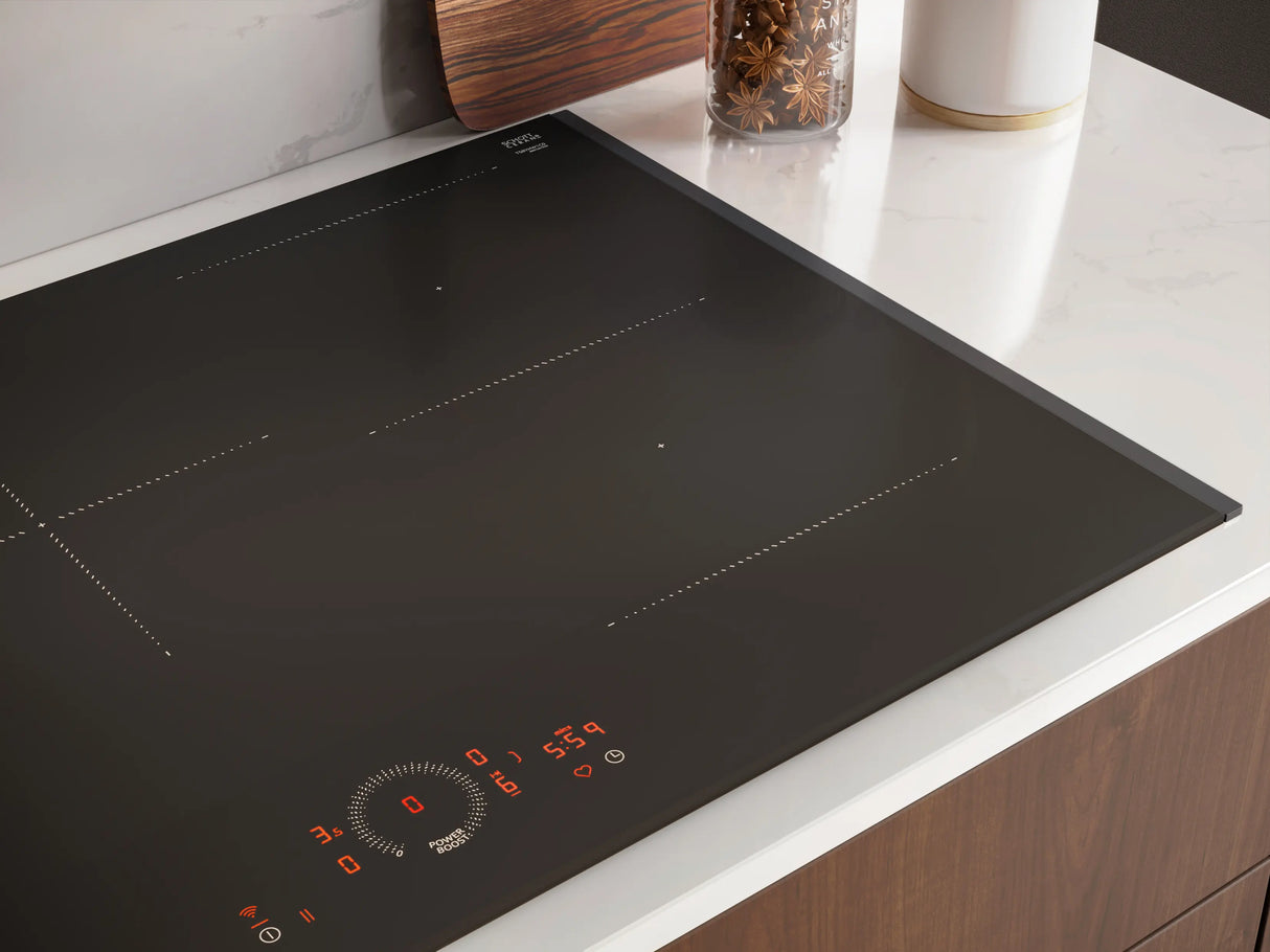 Neff T58FHW1L0 N70 80cm 5-Zone Induction Hob with Twist Touch® from HomeWise Appliances. Stock photo of the glass ceramic surface close up with digits illuminated.