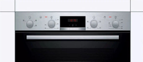 Bosch Series 2 MHA133BR0B (79) Built In Electric Double Oven in Stainless Steel from HomeWise Appliances. Stock photo showing control panel with dial knobs and Red LED clock display.