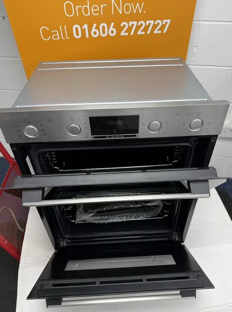 Bosch Series 4 NBS533BS0B Electric Built-Under Electric Double Oven in Stainless Steel from HomeWise Appliances. Stock photo showing oven from above with top casing on display and doors open.